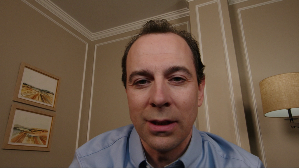 Bo’s human-looking video persona appears close to the camera during a call in Cupertino episode 2.