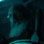 Ultron takes over Vision: a bearded Ultron in glasses grips the wheel inside Vision’s mind in VisionQuest